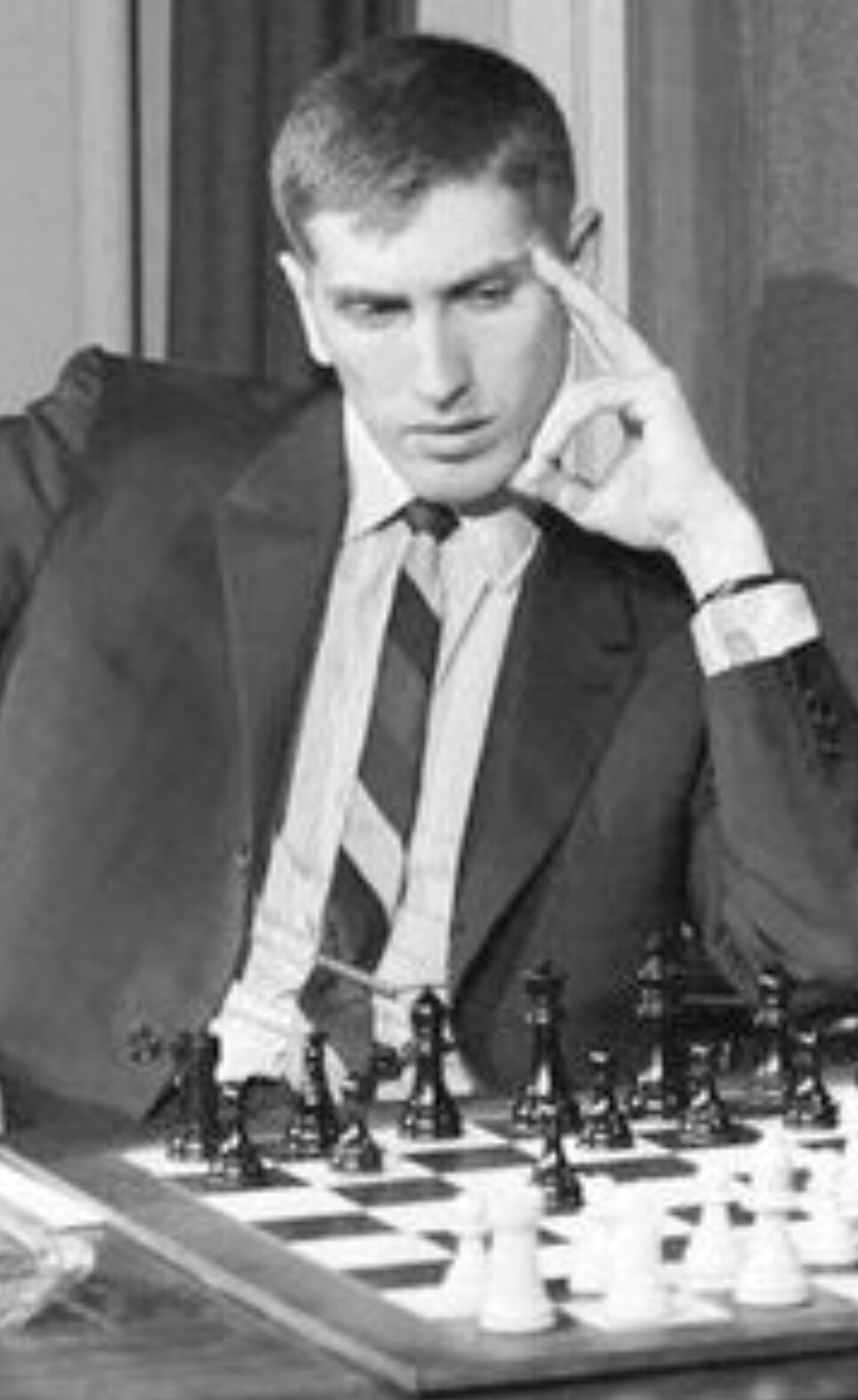 Chess champion Bobby Fischer working on his moves during a subway