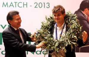 Magnus crowned World Champion in 2013 with FIDE president Iljoemzjinov